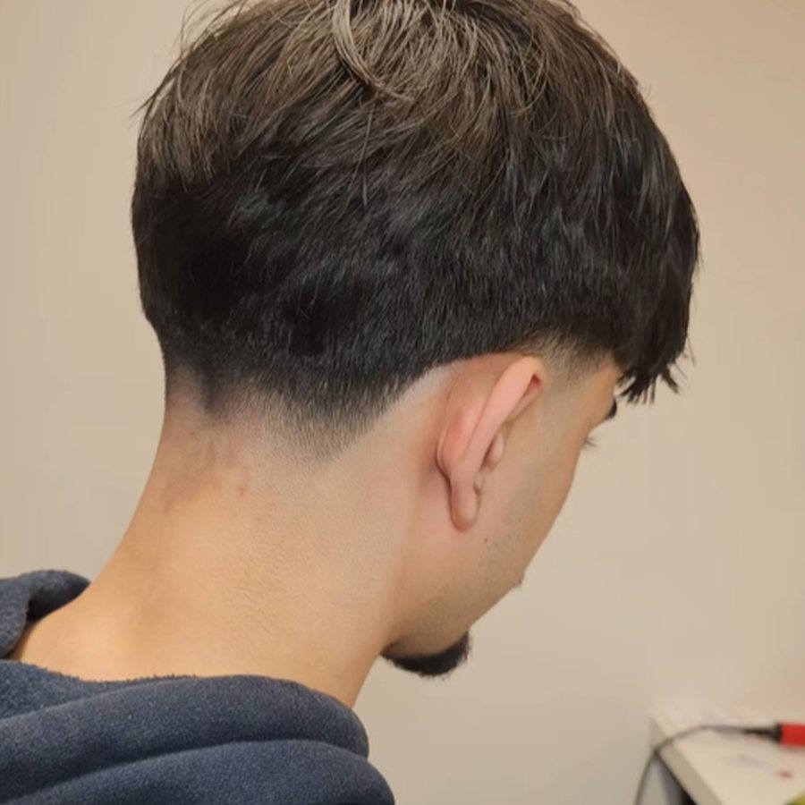 Back view of a taper fade haircut